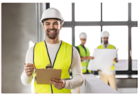 A worker in a hard hat and vest holding a clipboard.