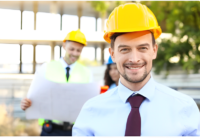 Man wearing hard hat and tie.