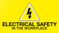 Yellow hazard sign reading "Electrical Safety in the Workplace"